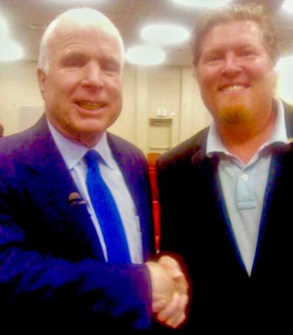 Daniel Patterson shaking hands with US Senator John McCain